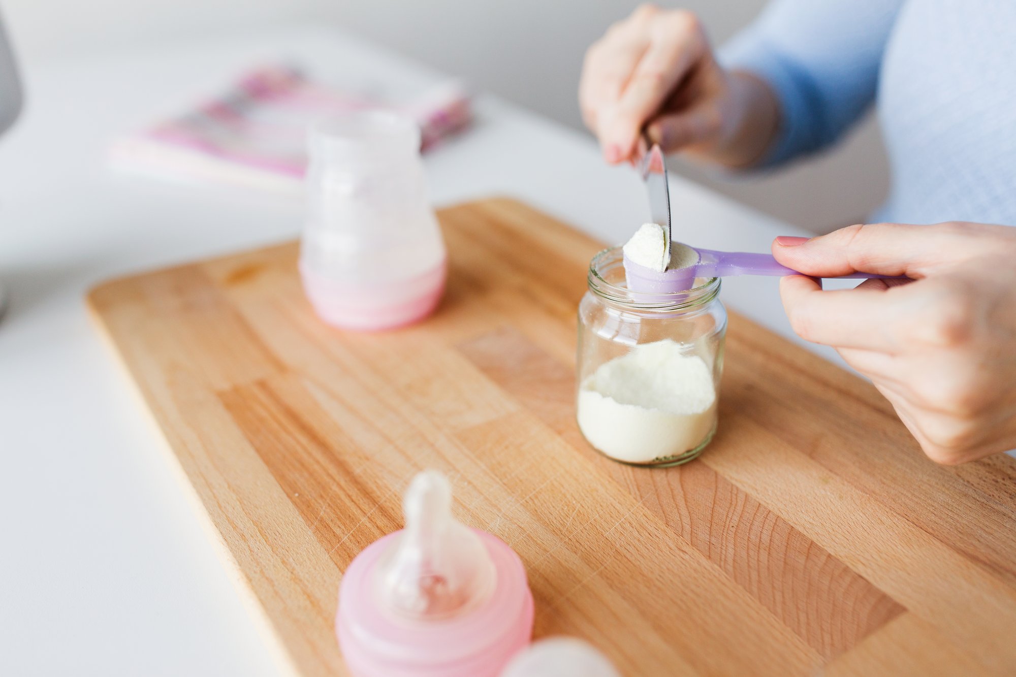 Preparing infant formula in a kitchen Preparing infant formula in a kitchen
